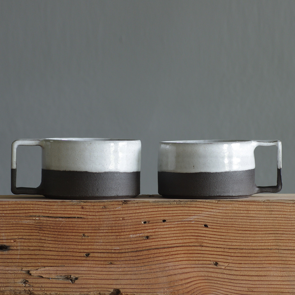 pair of low mugs brown and white